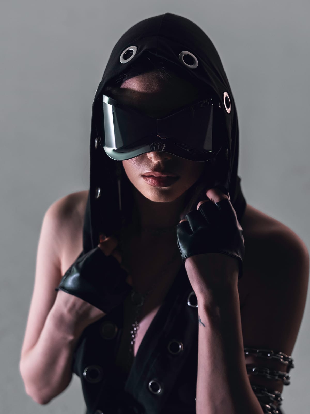 ELL3NI in hooded mask and goggles